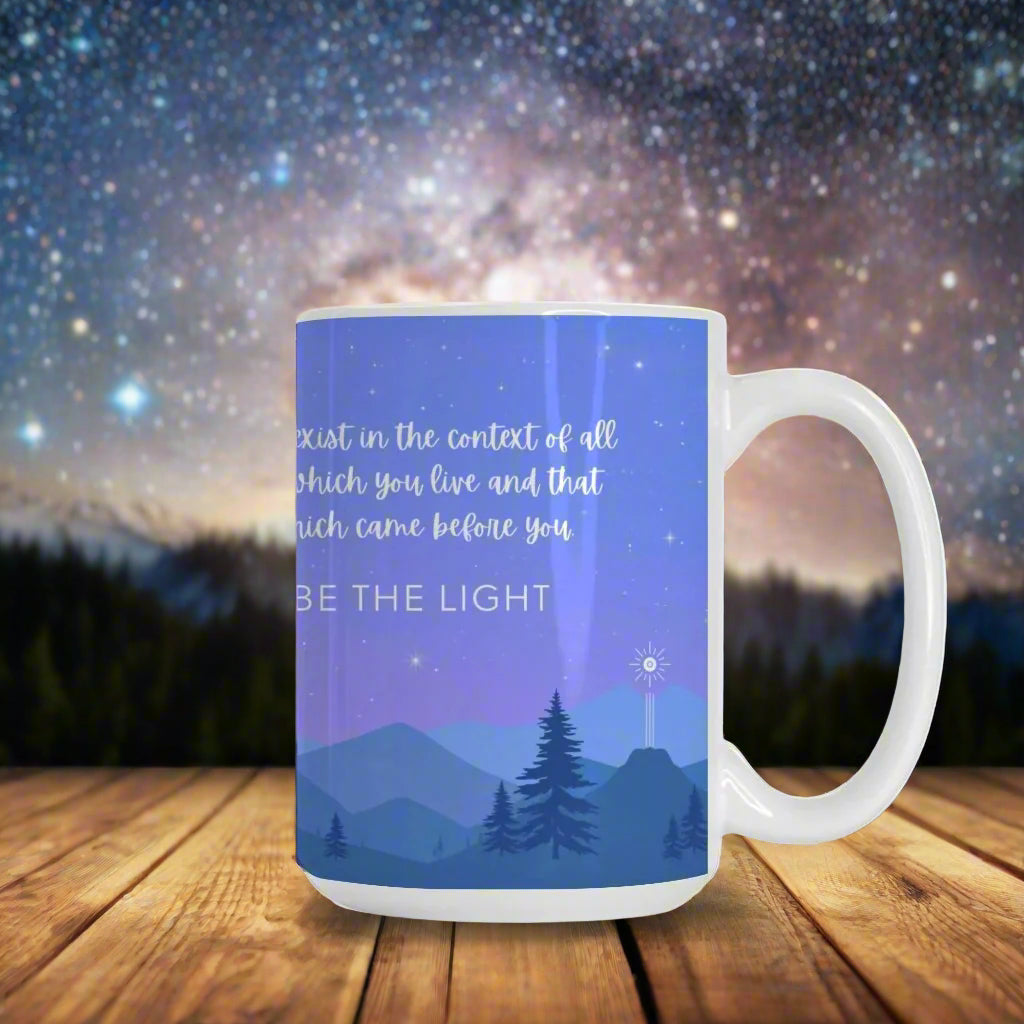 Ceramic mug featuring a starry night sky over mountains, with the Flower of Life as the moon, a commemorative comet, and the phrase 'You are made of stars - BE THE LIGHT' inspiring mindfulness and cosmic connection.