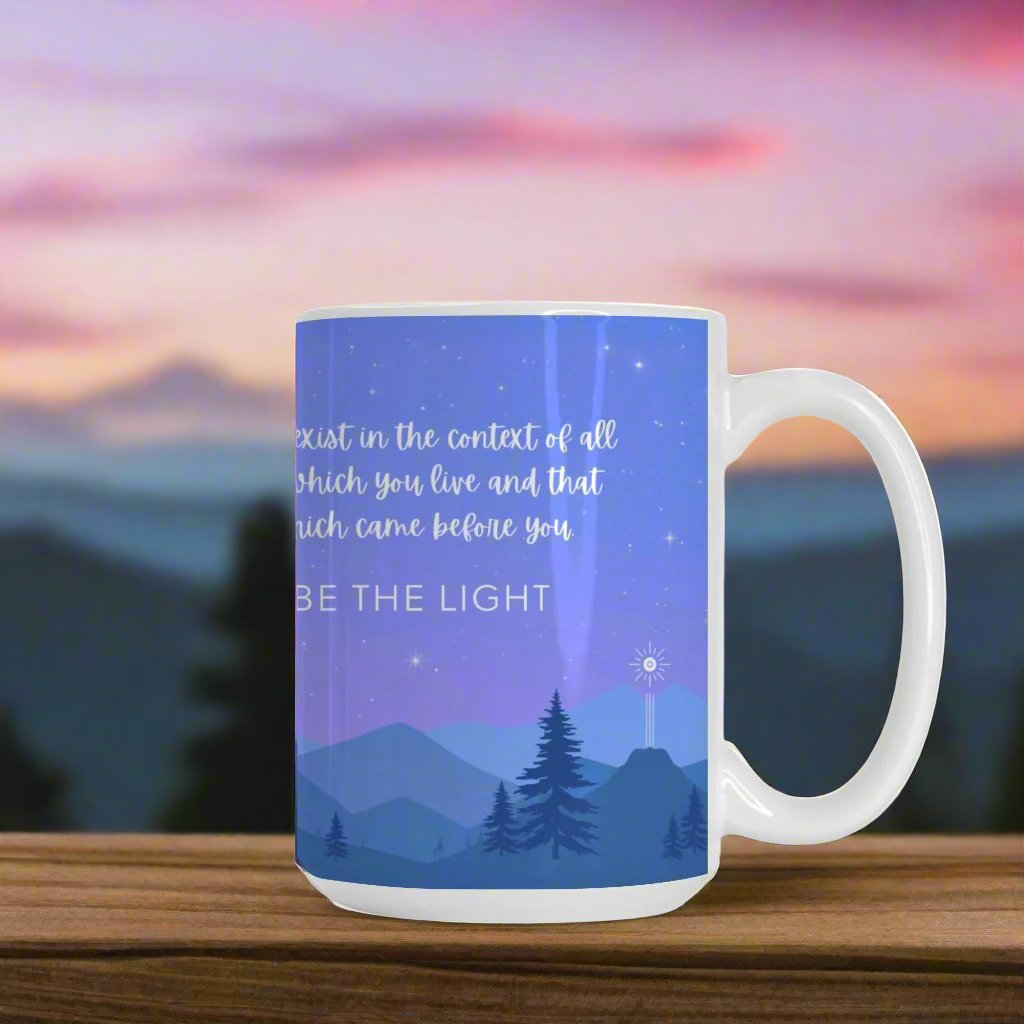 Ceramic mug featuring a starry night sky over mountains, with the Flower of Life as the moon, a commemorative comet, and the phrase 'You are made of stars - BE THE LIGHT' inspiring mindfulness and cosmic connection.